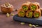 Traditional turkish, arabic sweets baklava.rolls with pistachio. Closeup, selective focus