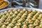 Traditional Turkish baklava sweets in the open buffet in a hotel in Turkey