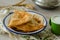 Traditional turkish borek, ciborek on the wooden table,