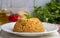 Traditional turkish bulgur pilaf with tomato sause in plate - Turkish name meyhane pilav-