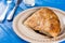 Traditional turkish burek with meat served on the blue wooden background