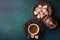 Traditional turkish coffee and turkish delight on dark green wooden background. flat lay