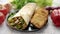 Traditional Turkish doner kebab in a wrap served with fresh ingredients and deep fried dumplings