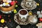 Traditional Turkish Hard,Colorful Almond Candies and Traditional Turkish Coffee on black