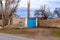 Traditional Turkish house with iron garden gate and iron water well with pulley