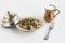 Traditional Turkish Islamic Feast Food with braised meat and pilaff in vintage copper bowl with buttermilk and metal fork,on whit