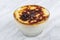 Traditional Turkish oven rice pudding in a glass bowl. marble background