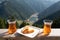 Traditional turkish tea and cake with the scenery view of Uzungol lake down in a valley