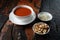 Traditional Turkish tomato soup on rustic wooden background