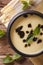 Traditional Turkish Yayla soup with mint and yogurt close up vertical top view