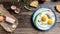 Traditional Ukrainian or belorussian food. Breakfast, lunch bacon, lard fried eggs and toast on old wooden table. banner, catering