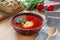 Traditional Ukrainian dish red borscht with donuts