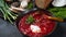 Traditional Ukrainian Russian borscht . Bowl of red beet root soup borsch with white cream .
