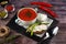 Traditional Ukrainian Russian borscht in a plate. A plate of red beet borscht on a dark table. Beetroot garden Top view.