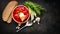 Traditional Ukrainian russian borscht. Plate of red beet root soup borsch on black rustic table. Beetroot soup top view