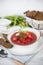 Traditional Ukrainian and Russian soup borscht with beef and beetroot on a white background.