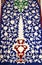 Traditional Uzbek pattern on the ceramic tile on the wall of the mosque. Islamic mosaics pattern or abstract background