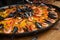 Traditional Valencian seafood paella with prawns and mussels