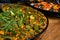 Traditional Valencian vegetarian vegetable paella with snap-beans