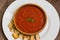 Traditional vegetable gazpacho. Wooden rustic background. Top view. Close-up