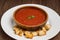 Traditional vegetable gazpacho. Wooden rustic background. Top view. Close-up