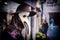 Traditional venetian mannequin in Plague doctor costume, mask and hat near shop window in the street of Venice, Italy. Toned image