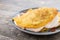 Traditional Venezuelan beef cachapa on wooden table