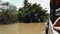 Traditional Vietnamese ferry boat taking people and their bicycles across the Mekong River in Vietnam, South East Asia