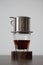 Traditional Vietnamese filtered coffee brewed in phin minimalist style