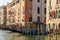 Traditional view of Venice, famous Gondolas in the canal and venetian palaces, Italy
