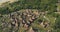 Traditional village, houses roofs closeup top down aerial view. Epic rural scenery of Sumba Island