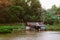 Traditional vinatge local floating house or raft house in river, Uthaithani, Thailand