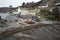 Traditional vintage Cornish fishing village landscape with boats