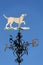 Traditional Weather Vane With a Dog on the Top.