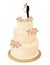 Traditional wedding cake decorated cream roses and bride and groom figurines married couple on top.