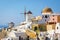 Traditional white architecture with blue churches on Santorini island, Greece