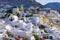 Traditional white buildings facing Aegean Sea in Oia, Santorini island, Greece