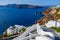 Traditional white buildings facing Aegean Sea in Oia, Santorini island, Greece