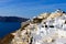 Traditional white buildings facing Aegean Sea in Oia, Santorini island, Greece