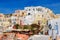 Traditional white buildings facing Aegean Sea in Oia, Santorini island, Greece