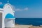 Traditional white chapel with a blue roof on the seaside. Agioi Anargyroi, Cyprus