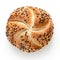 Traditional white kaiser roll with linseeds and sesame seeds isolated on white. Top view