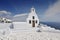 Traditional whitewashed Greek church overlooking Aegean Sea, Oia village, Santorini island, Cyclades, Greece, Europe