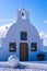 Traditional whitewashed Greek orthodox church in Oia