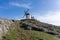 Traditional whitewashed Spanish windmills in La Mancha on a hilltop above Consuegra