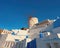 Traditional windmill and apartments in Oia village, Santorini, G