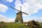Traditional windmill in dutch landscape