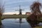 Traditional windmill on dyke, blue colour, Holland