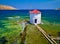 Traditional windmill in the sea. Landmark of Leros island, Greece, located at Agia (Saint) Marina coast