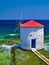 Traditional windmill in the sea. Landmark of Leros island, Greece, located at Agia (Saint) Marina coast